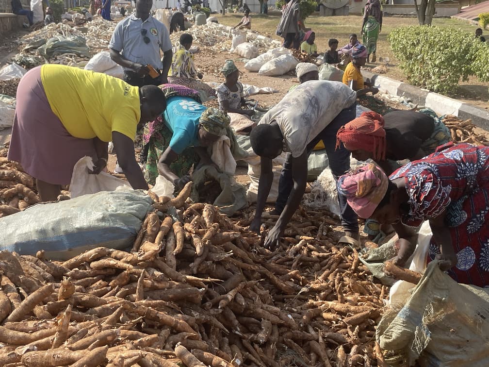 Cassav Farmers in Rwanda at Kinazi Cassava Processing Factor share ideas with Ed Airo Cassava Growers and Processors.jpeg